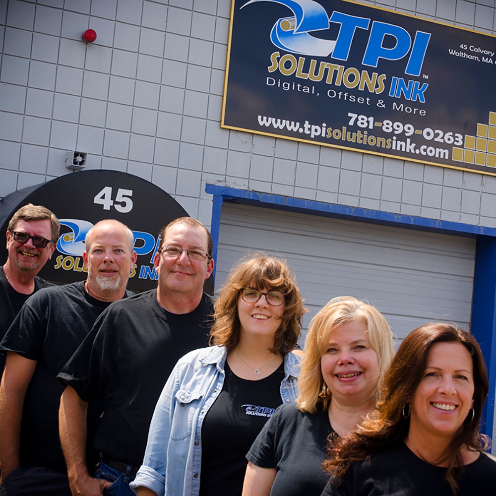 TPI Solutions Ink employee team in front of print shop in Waltham